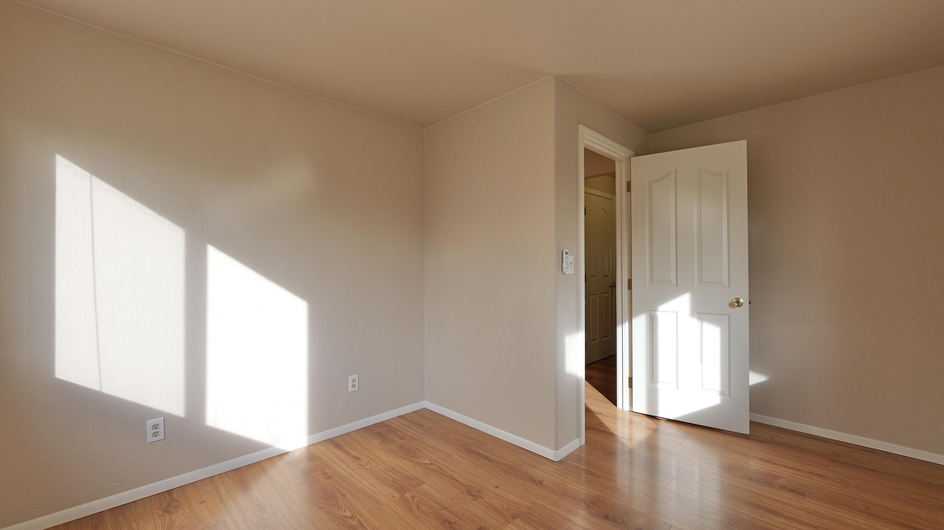 204 Shipley Terrace Prospect, OR 97536 - Photo 31 of 61 an empty room with wooden floor and windows