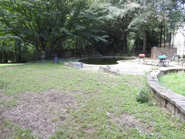 a view of outdoor space yard deck patio and fire pit