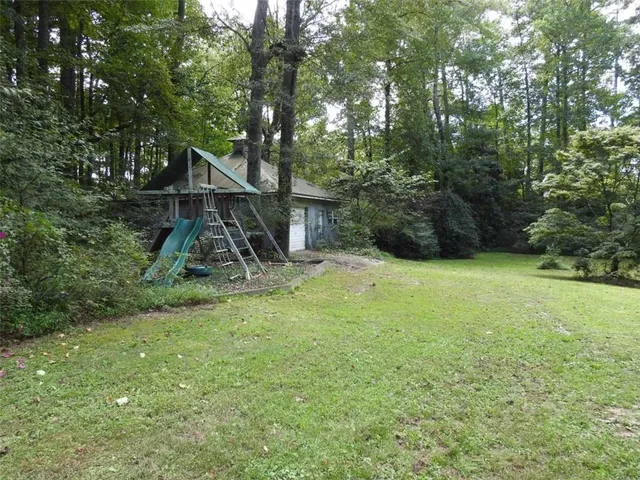 a backyard of a house with a garden and entertaining space