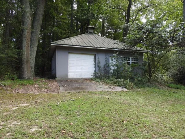 a view of a house with a tree
