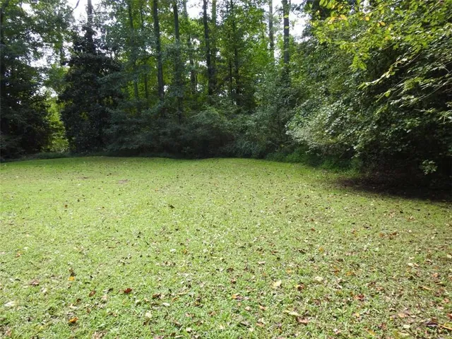 a wooden bench sitting next to a lake