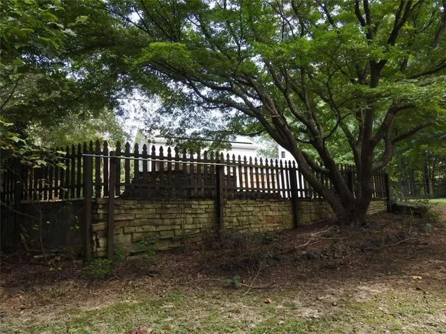 a view of swimming pool with a yard