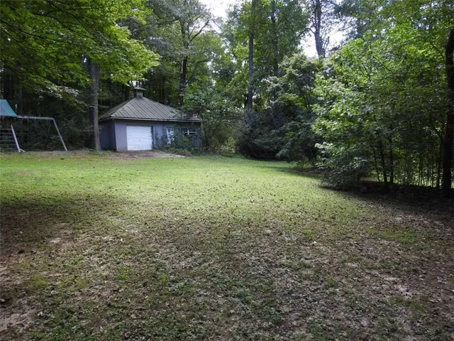 a view of swimming pool with a yard