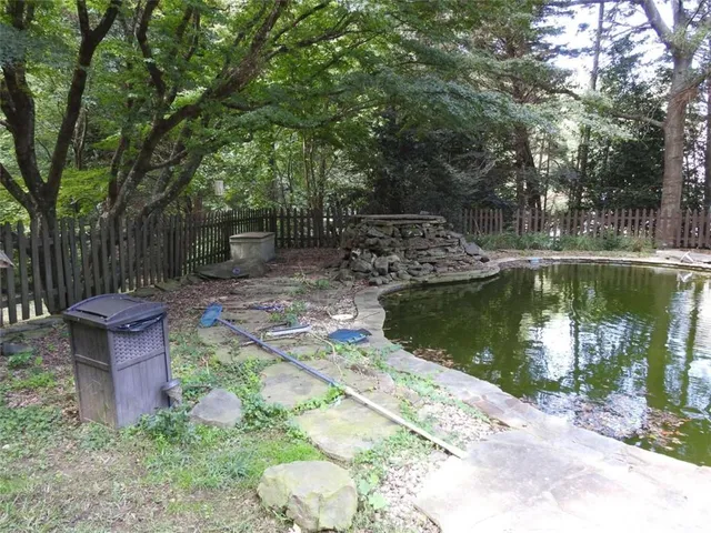 a bedroom with a bed and a mirror