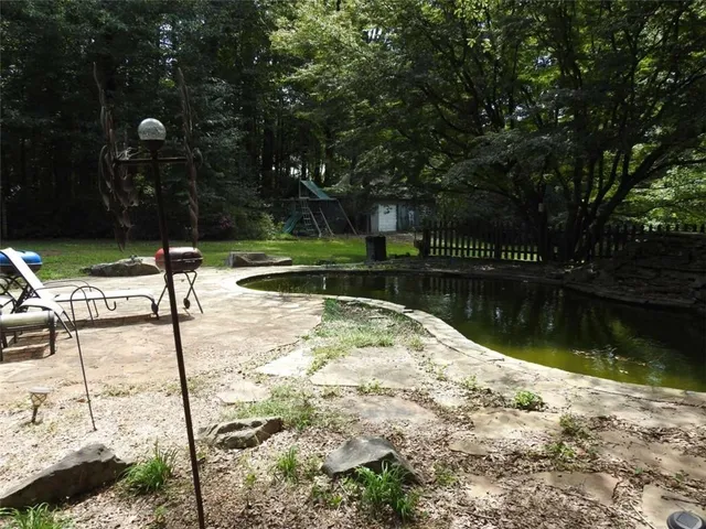 a bathroom with a sink a toilet a mirror and shower