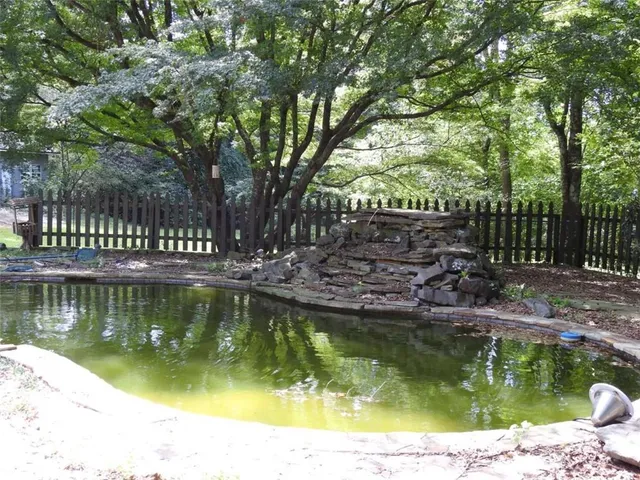 a bathroom with a toilet sink and shower