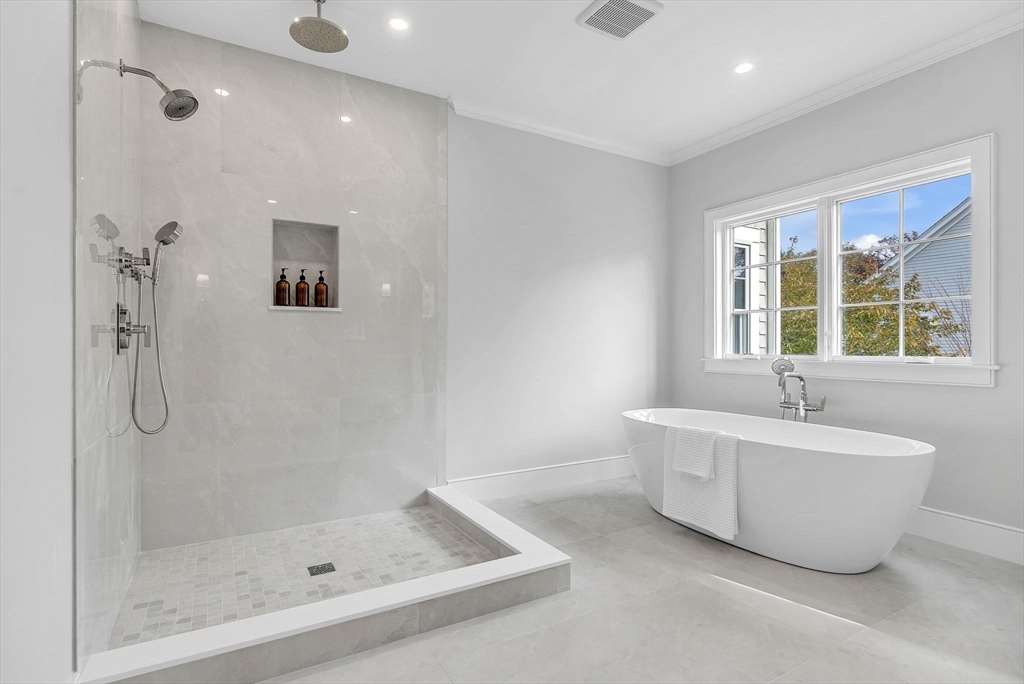 51 Boulder Brook Road Wellesley, MA 02481 - Photo 16 of 39 a spacious bathroom with a bathtub and shower