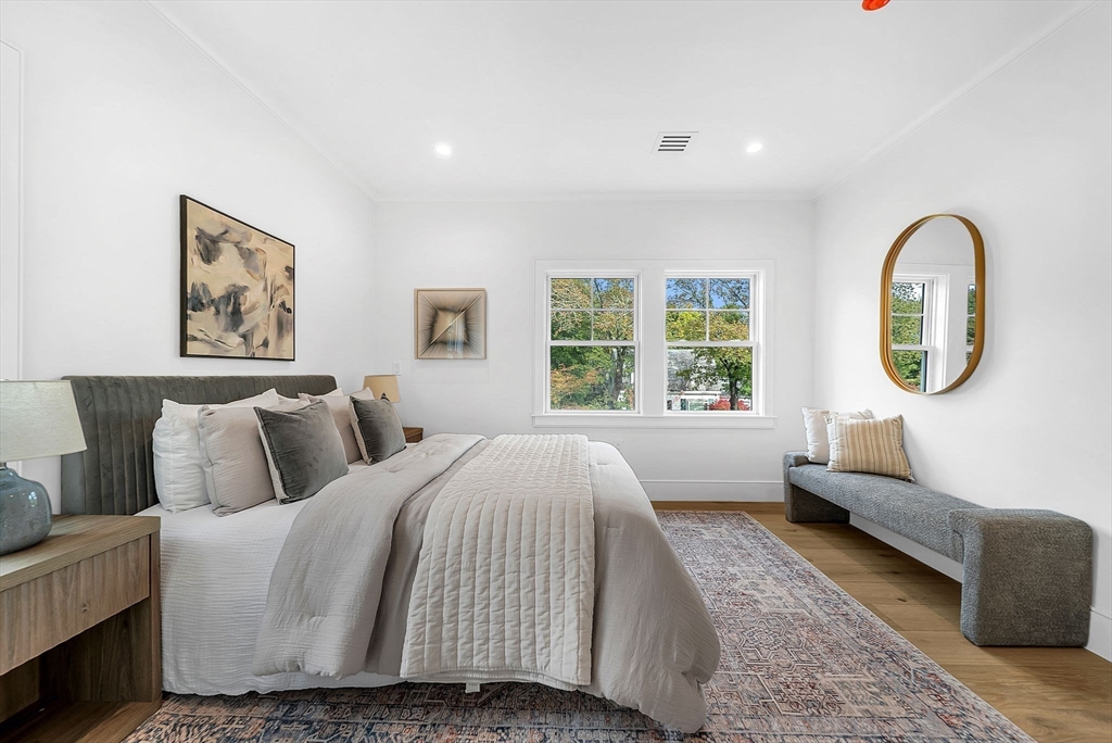 51 Boulder Brook Road Wellesley, MA 02481 - Photo 18 of 39 a spacious bedroom with a bed a couch and a large window