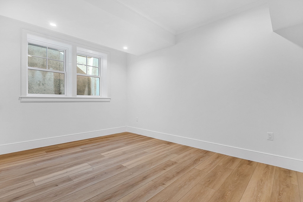 51 Boulder Brook Road Wellesley, MA 02481 - Photo 30 of 39 wooden floor in an empty room with a window