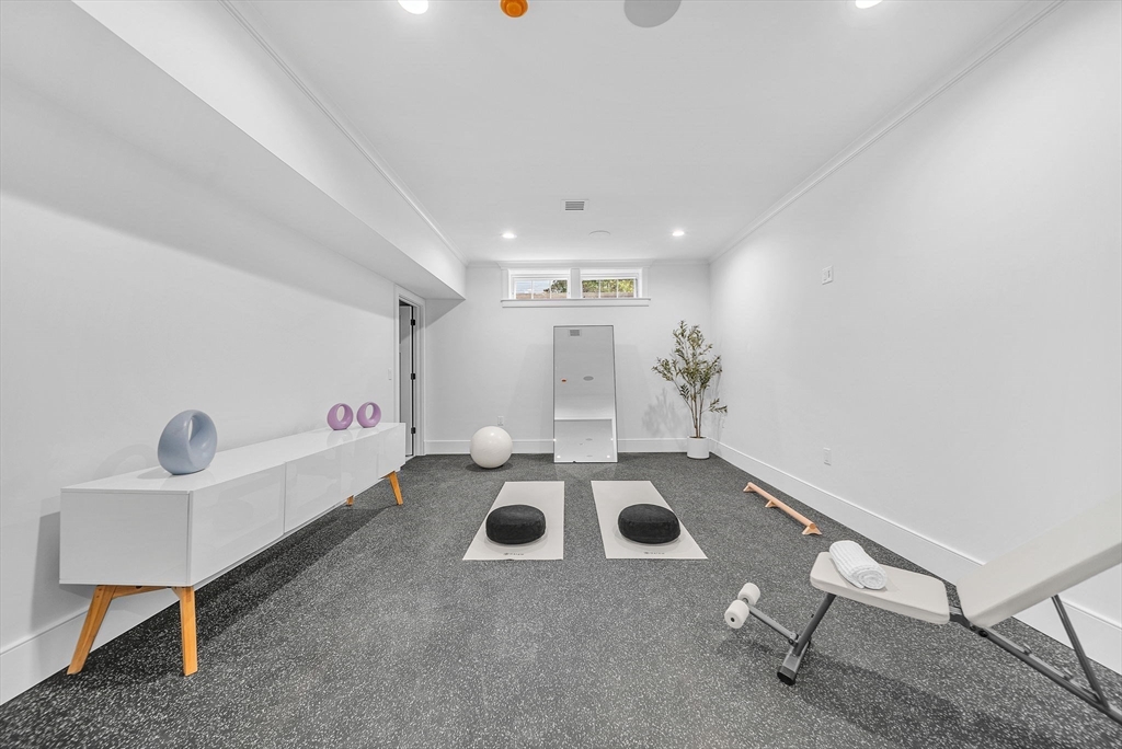 51 Boulder Brook Road Wellesley, MA 02481 - Photo 32 of 39 a kitchen with a sink a stove and white cabinets