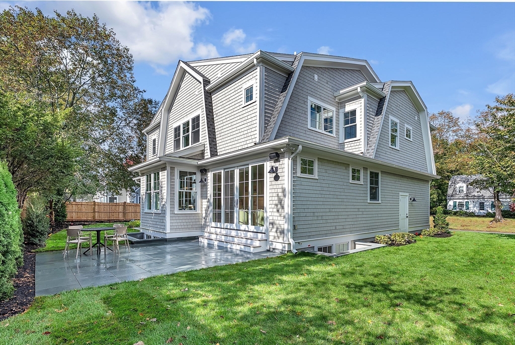 51 Boulder Brook Road Wellesley, MA 02481 - Photo 34 of 39 a front view of a house with a garden
