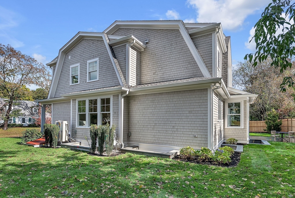 51 Boulder Brook Road Wellesley, MA 02481 - Photo 35 of 39 a front view of a house with a yard