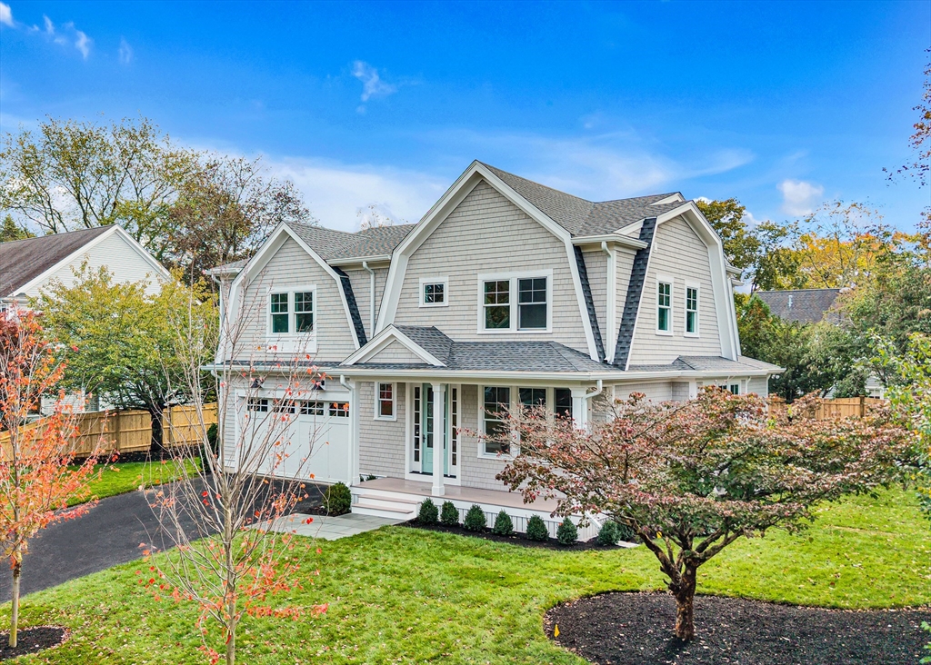 51 Boulder Brook Road Wellesley, MA 02481 - Photo 36 of 39 a front view of a house with a yard