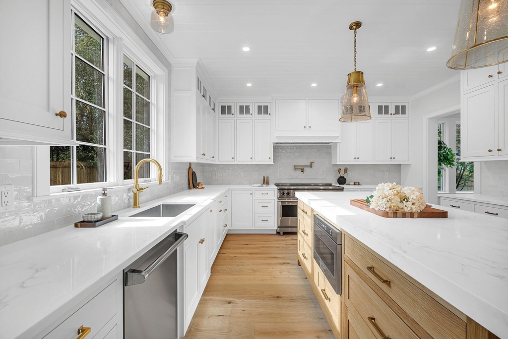 51 Boulder Brook Road Wellesley, MA 02481 - Photo 4 of 39 a large kitchen with stainless steel appliances lots of counter space and a sink