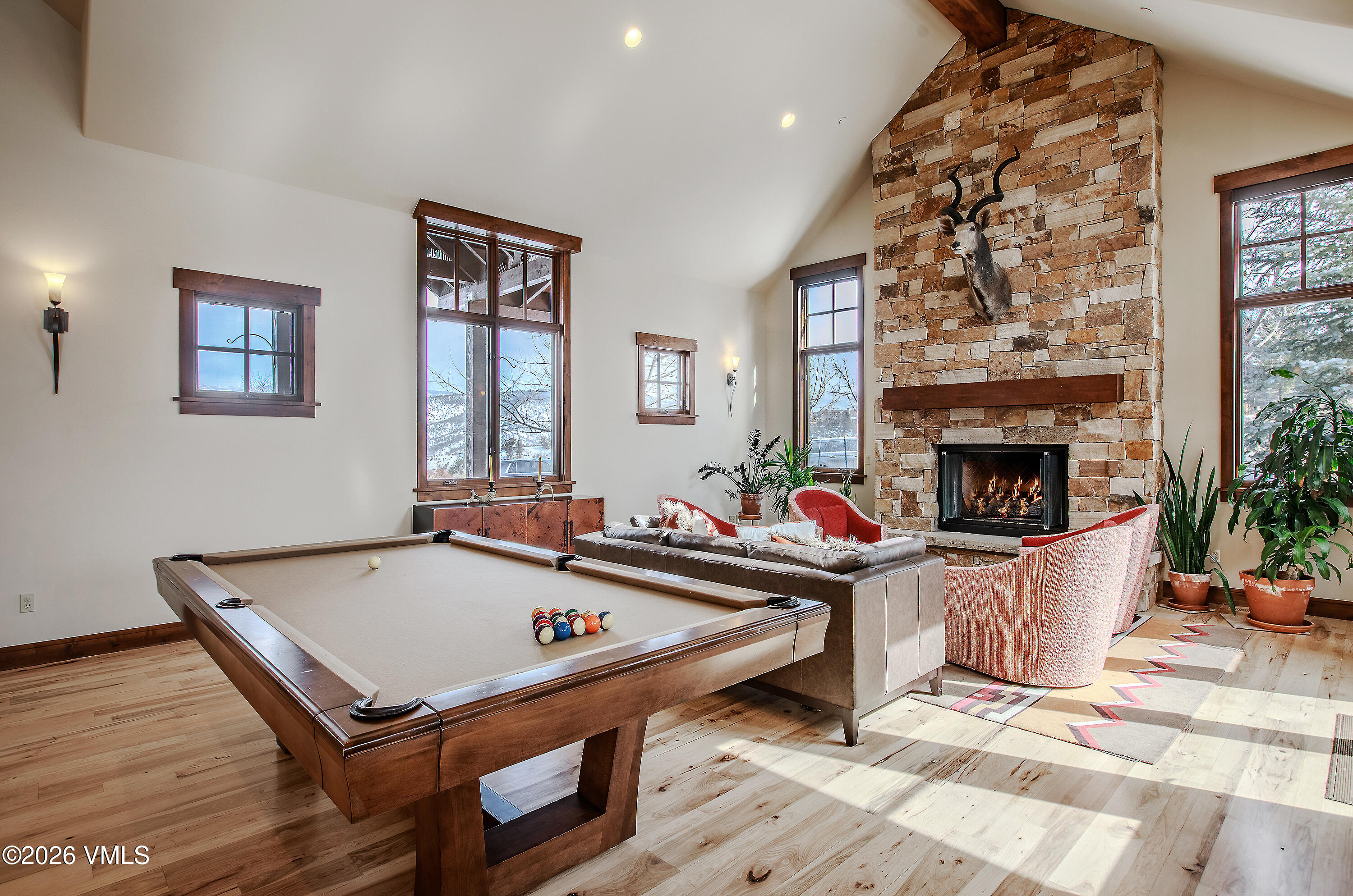 2753 East Haystacker Drive Eagle, CO 81631 - Photo 9 of 41 a room with furniture pool table and a fireplace