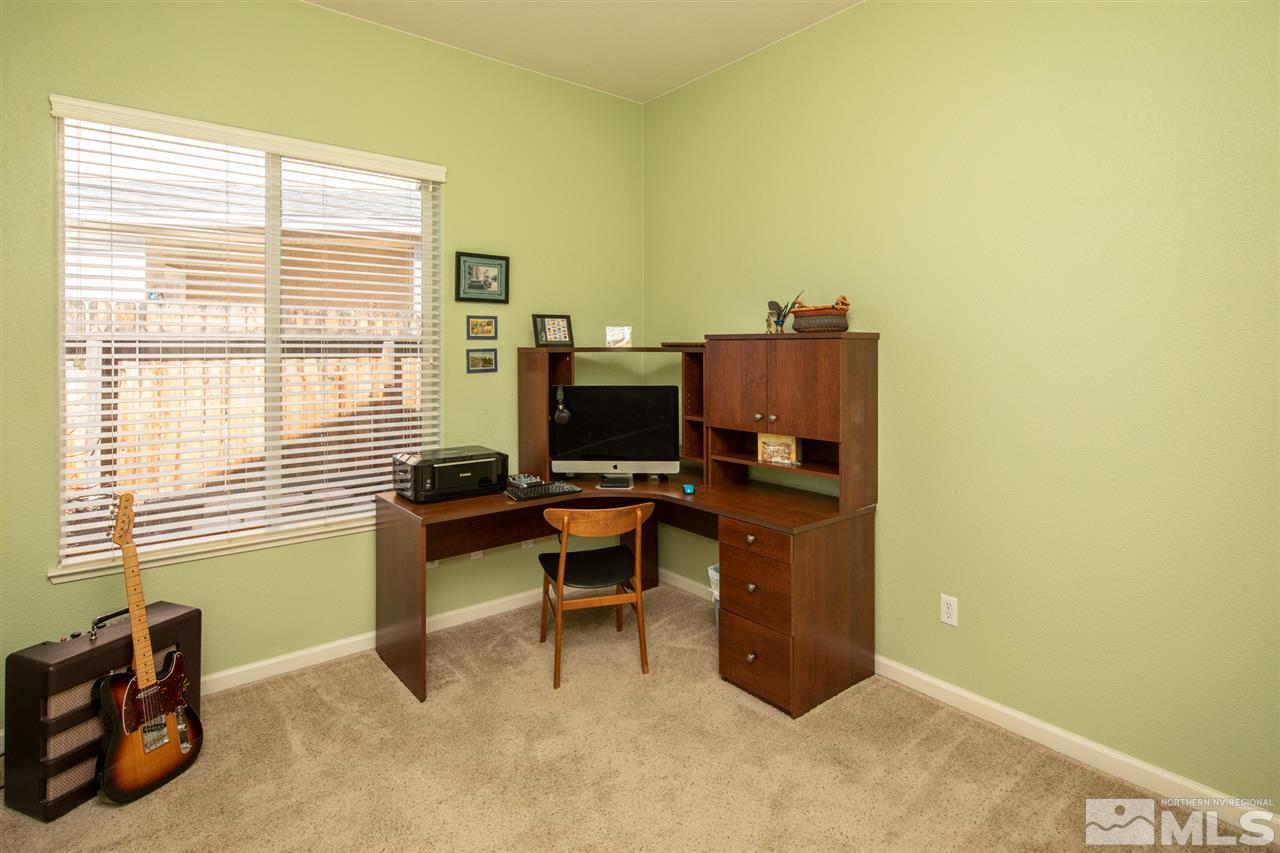 1448 Orca Way Reno, NV 89506 - Photo 3 of 9 a view of a workspace with furniture and a window
