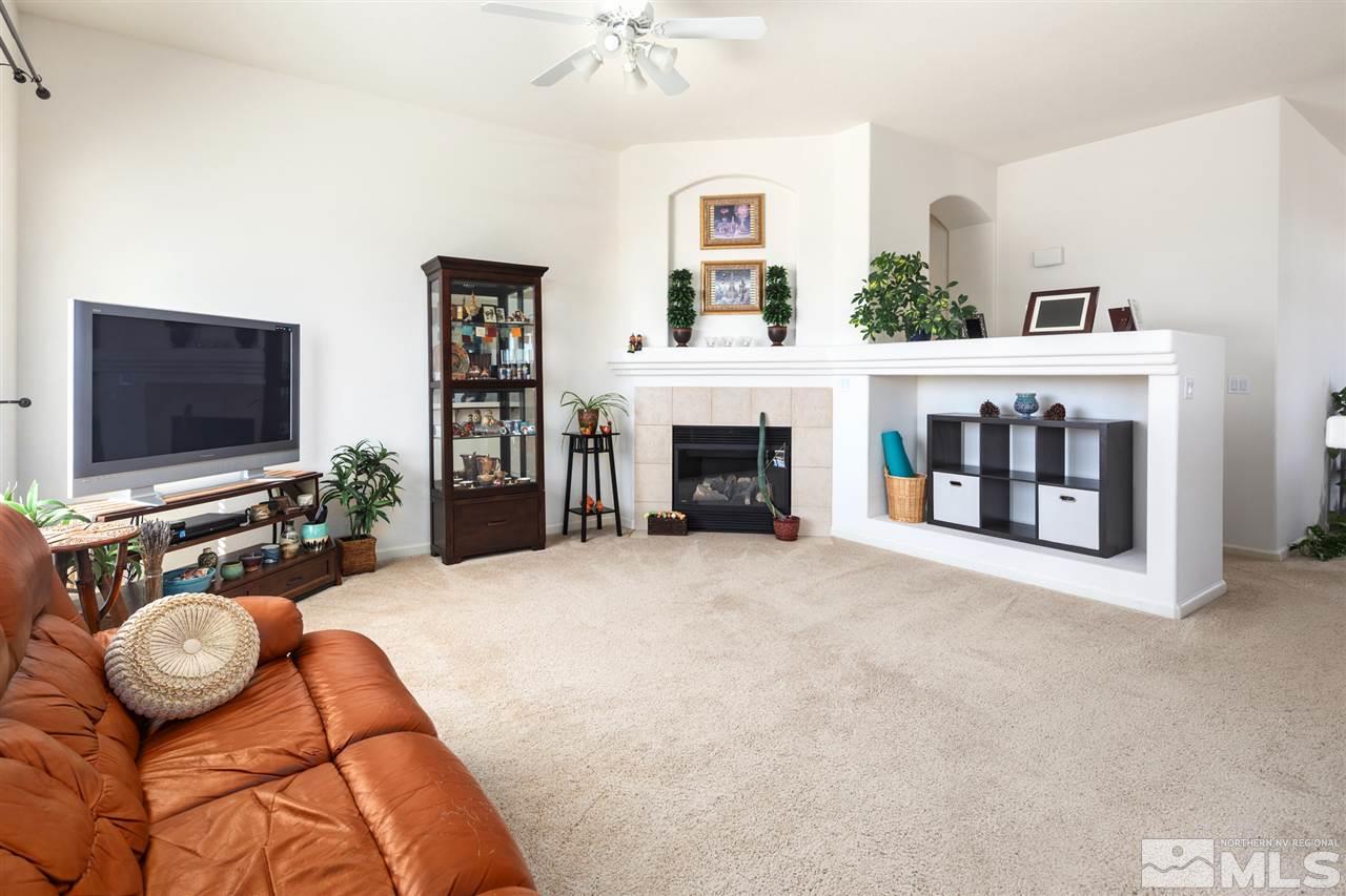 1448 Orca Way Reno, NV 89506 - Photo 7 of 9 a living room with furniture and a flat screen tv