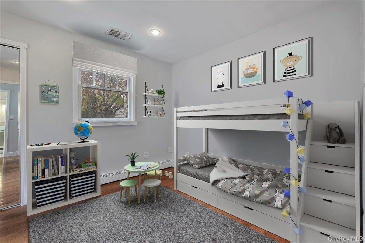 193 Nelson Road Scarsdale, NY 10583 - Photo 25 of 37 a living room with furniture and paintings on the wall