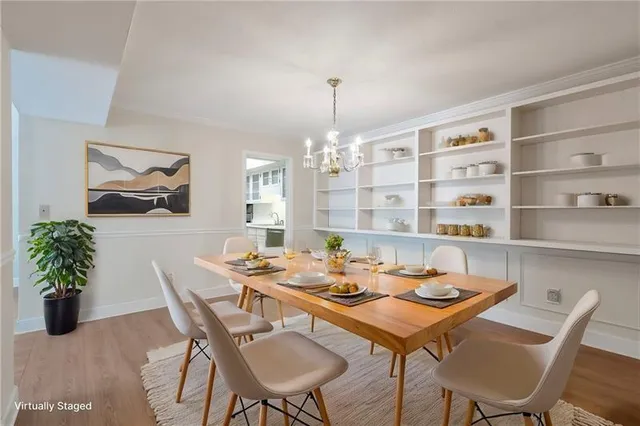 a view of a dining room with furniture window and wooden floor