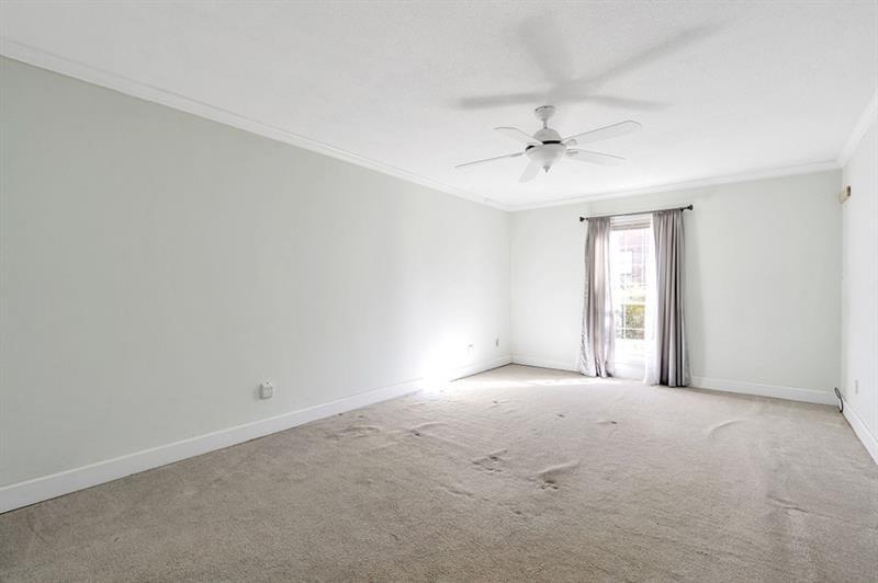 6851 Roswell Road, Unit D14 Atlanta, GA 30328 - Photo 14 of 30 a view of an empty room with a window