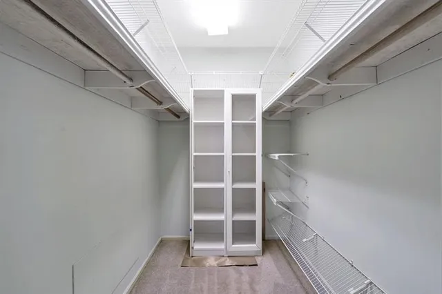 a view of an empty walk in closet