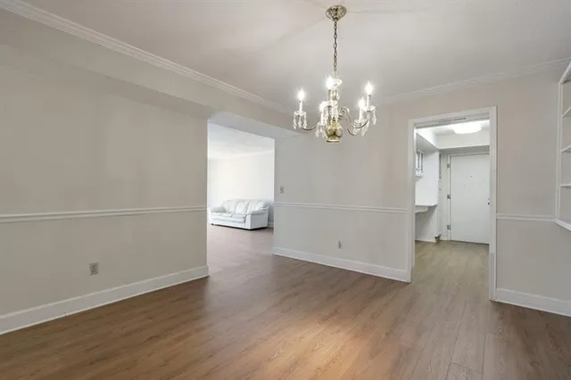 a view of a livingroom with wooden floor