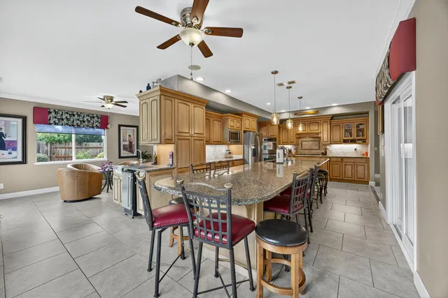 a dining room with furniture and window