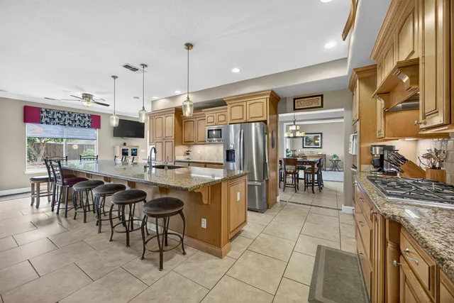 a kitchen with kitchen island granite countertop lots of counter top space