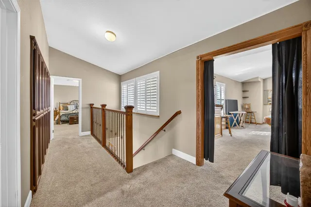 a view of a hallway with staircase