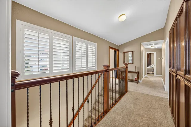 a view of a hallway with windows