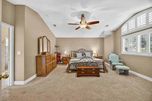 a bedroom with furniture and a window