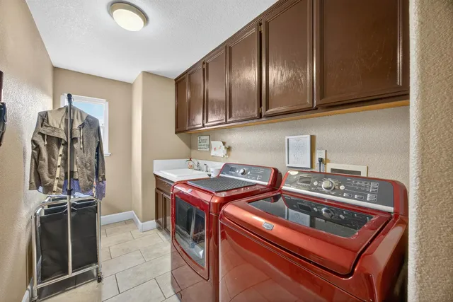 a kitchen with stainless steel appliances granite countertop a stove and a refrigerator