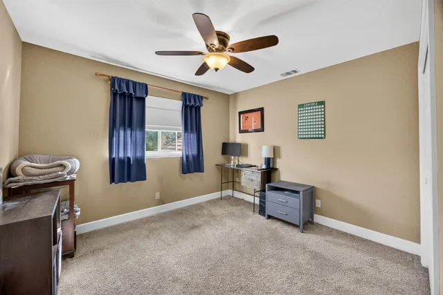 a living room with furniture and window