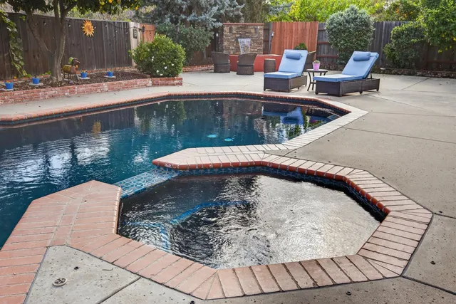 a view of a swimming pool with a patio