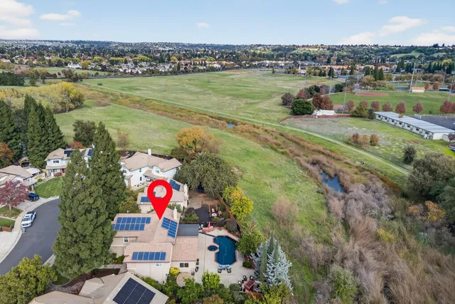 an aerial view of a houses with outdoor space