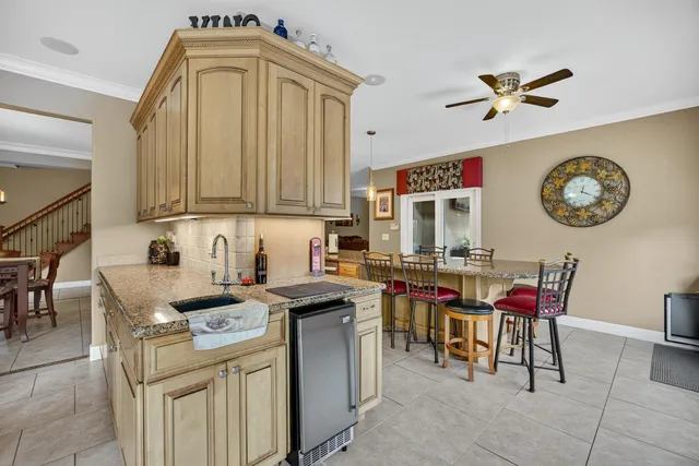 a kitchen with a cabinets and chairs