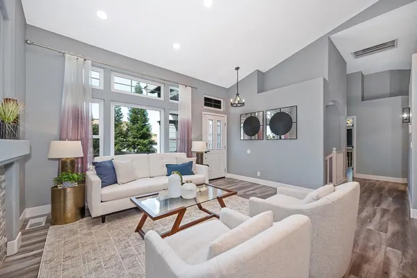 a view of a dining room with furniture and wooden floor