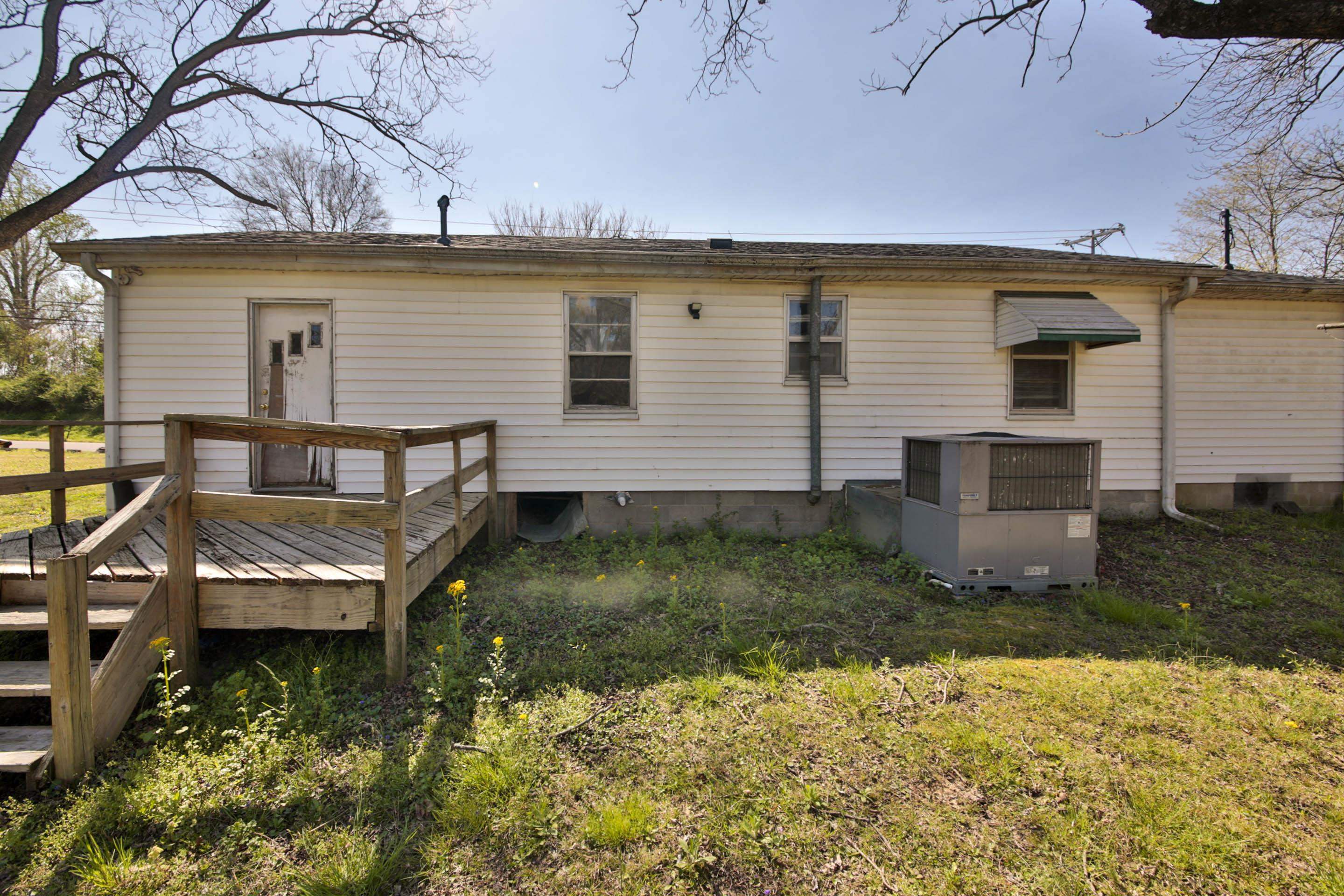 322 Highland Street Ripley, TN 38063 - Photo 4 of 12 Back of house featuring a wooden deck