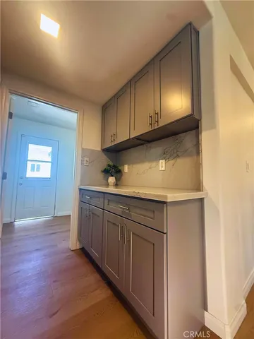a kitchen with granite countertop cabinets and sink