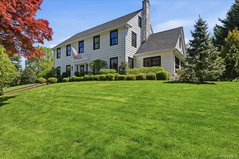 a front view of building with yard and green space