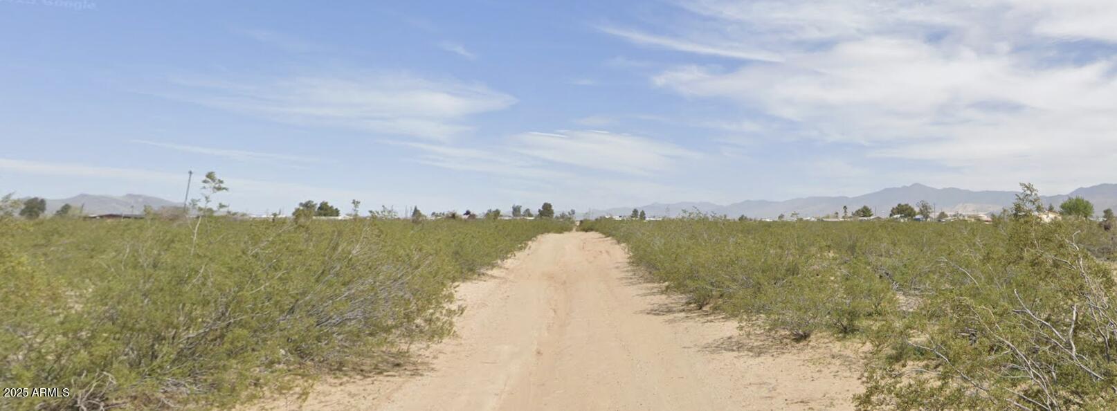 3689 Santa Cruz Road, Unit 3 Golden Valley, AZ 86413 - Photo 4 of 4 a view of a lake next to a building