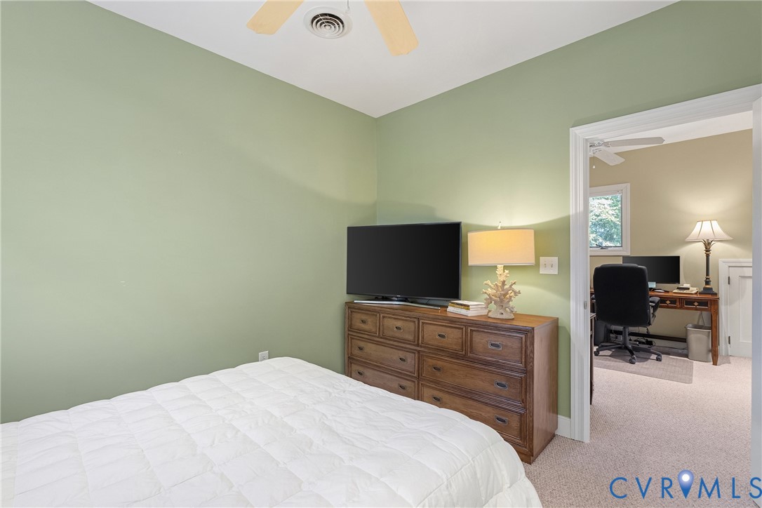 447 Tranquility Road Reedville, VA 22539 - Photo 45 of 82 Ceiling fan, light green wall paint, wood-finish d