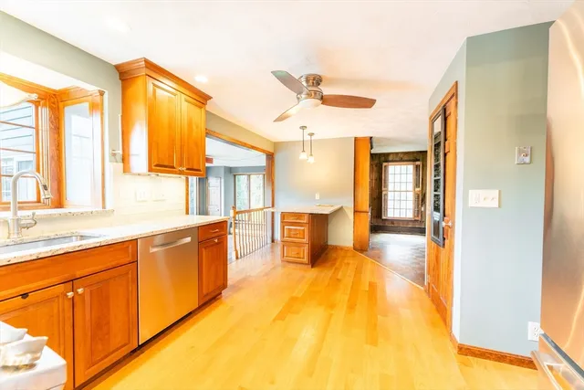 a large white kitchen with a large window