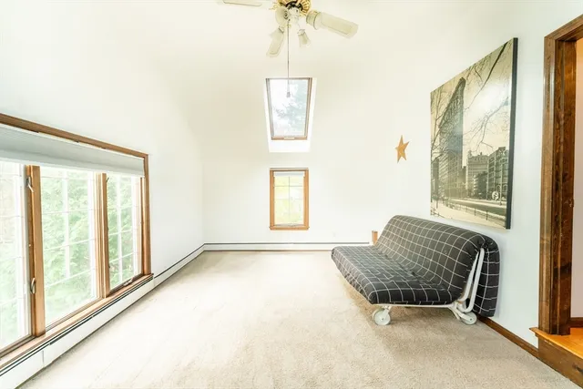 a room with a bed and a window