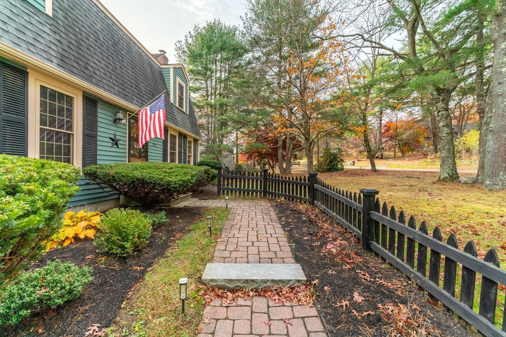 375 Winter Street Walpole, MA 02081 - Photo 7 of 40 a view of a pathway with a wrought fence