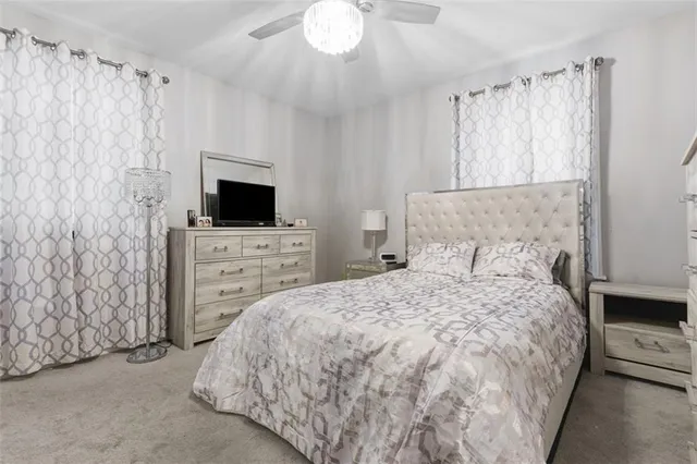 a bedroom with a bed and a television