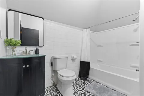 a bed room with a bed and a window