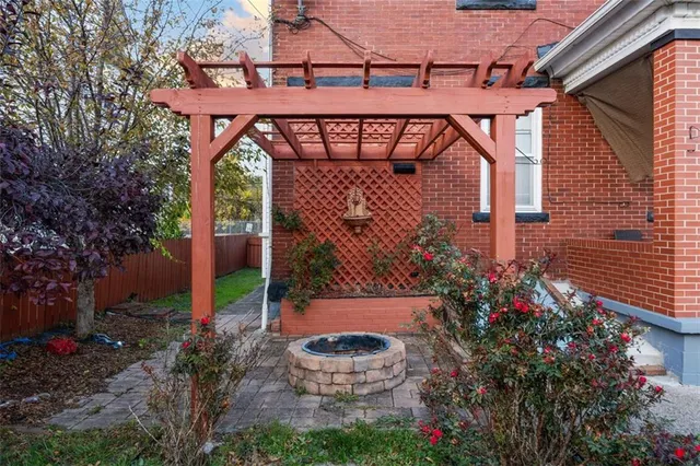 a view of a backyard with plants and a patio