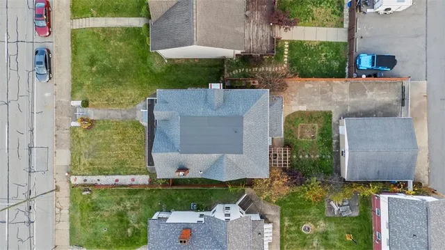 an aerial view of residential houses with outdoor space