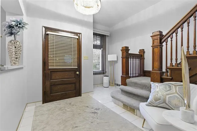 a bedroom with furniture and a balcony